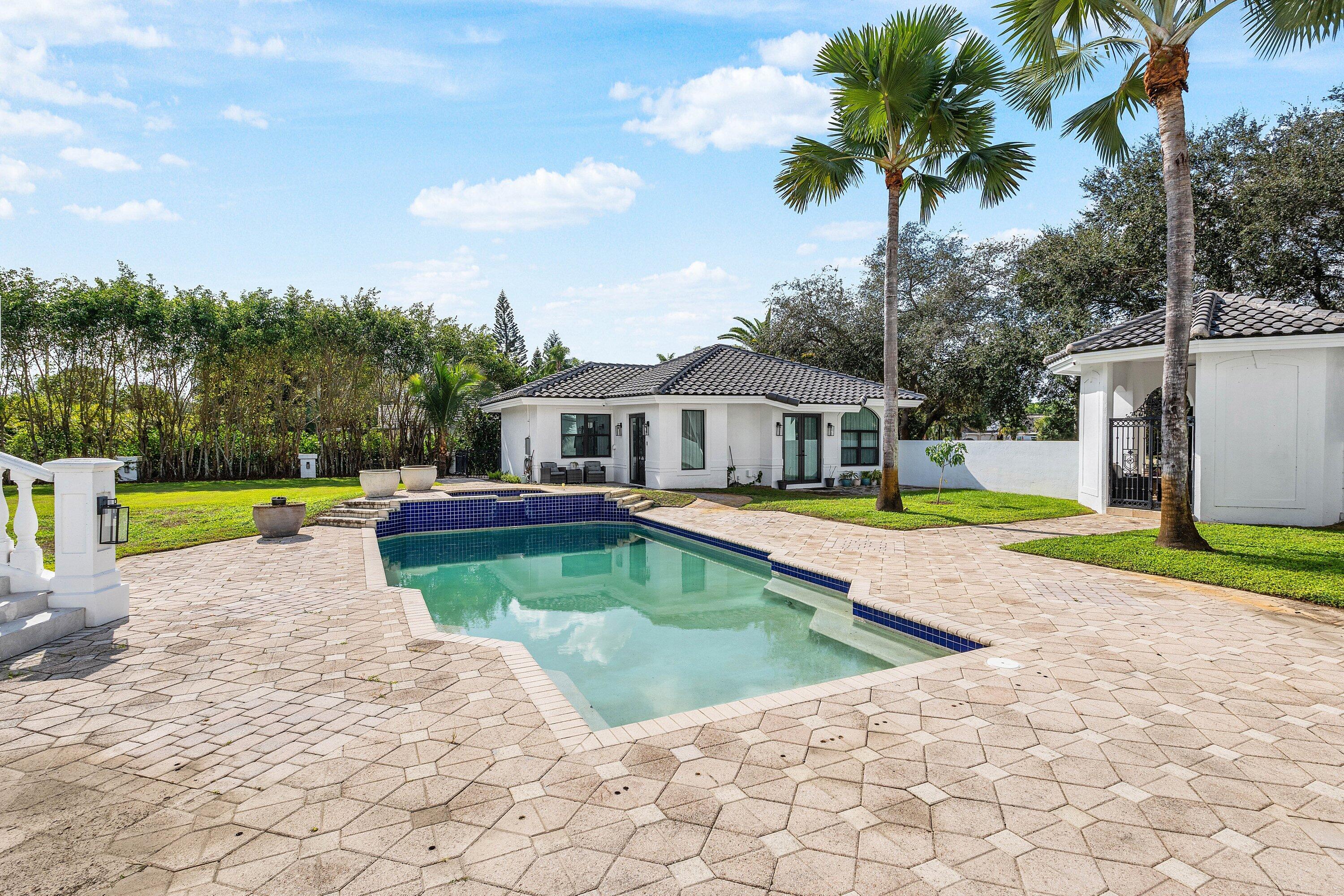 17600 Fieldbrook Circle East Boca Raton, FL 33496 - Photo 62 of 91 a house with swimming pool in front of it