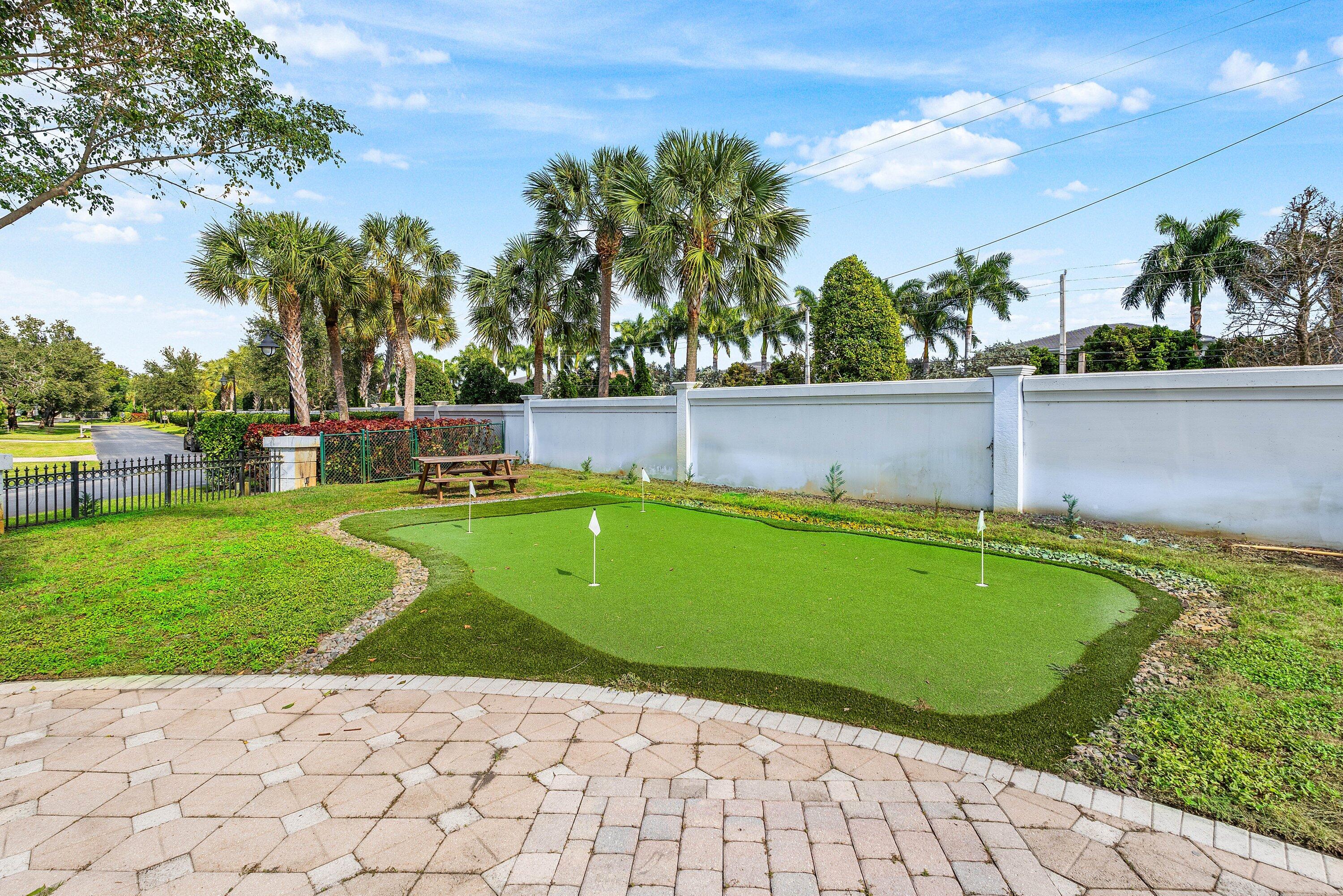 17600 Fieldbrook Circle East Boca Raton, FL 33496 - Photo 67 of 91 a view of a swimming pool with a yard