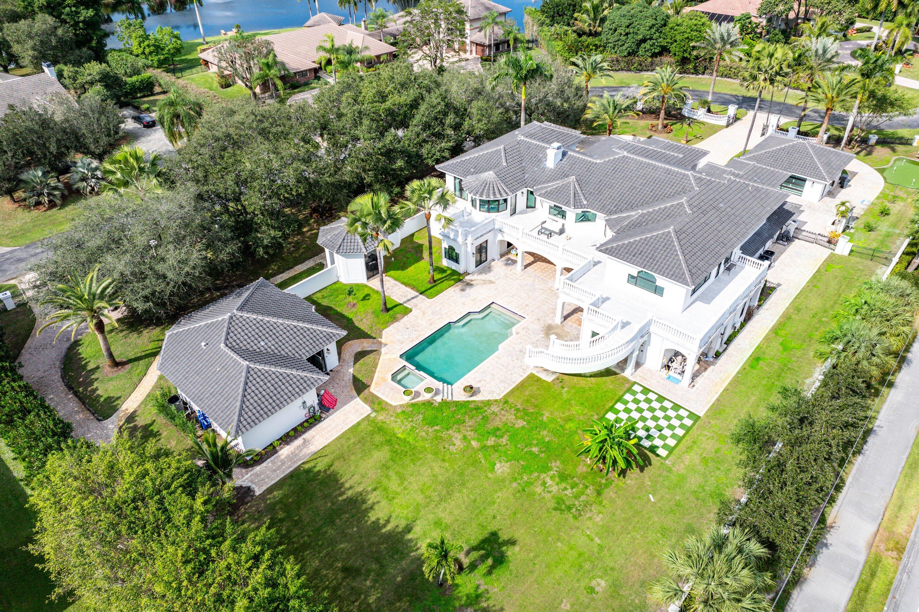 17600 Fieldbrook Circle East Boca Raton, FL 33496 - Photo 83 of 91 an aerial view of a house with a garden and swimming pool