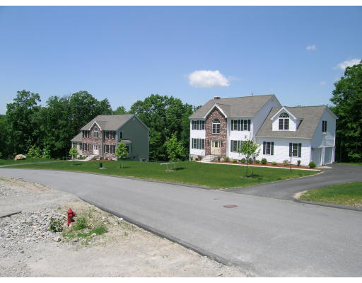 Lot 20 West Ledge Road Clinton, MA 01510 - Photo 4 of 8 a front view of a house with a yard and garage