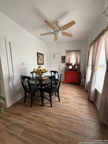 a view of a dining room with furniture window and wooden floor