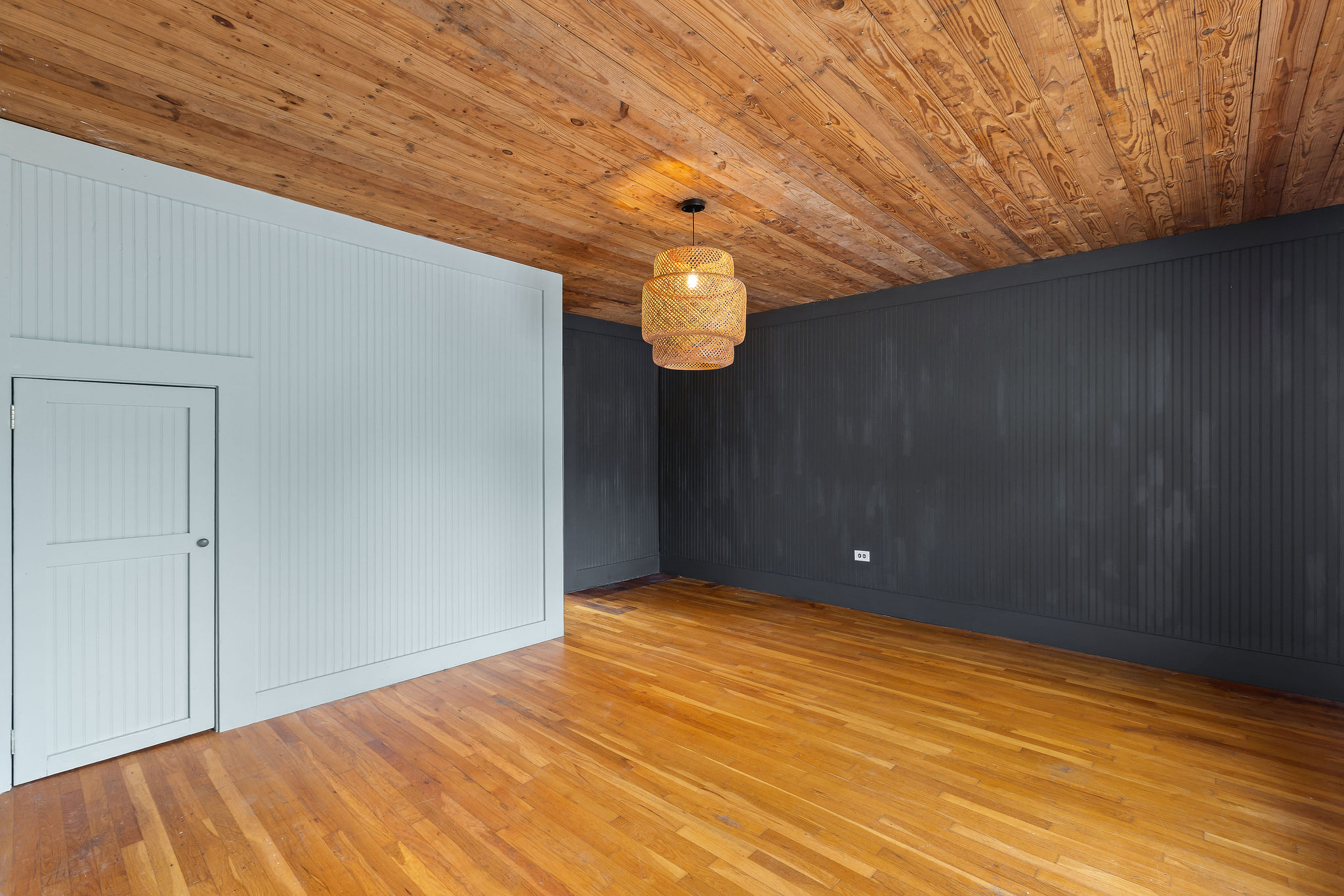 948 Maple Street Lockhart, TX 78644 - Photo 20 of 40 Warm wood ceilings and floors create an inviting atmosphere in this versatile living space.