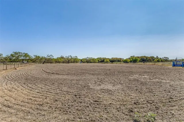 a view of a yard with table and chairs