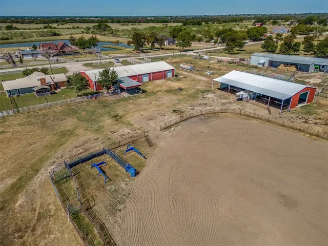 a view of swimming pool with a lawn chairs