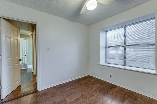 a bathroom with a shower a mirror and a sink