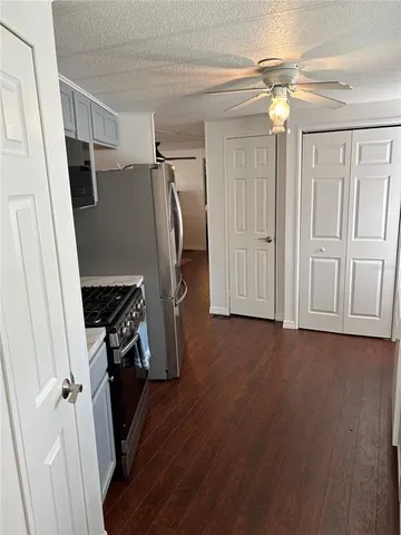 a view of a storage and utility room with washer and dryer