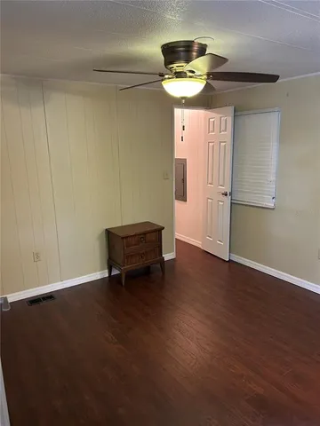 an empty room with wooden floor