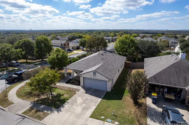 an aerial view of a house with a garden