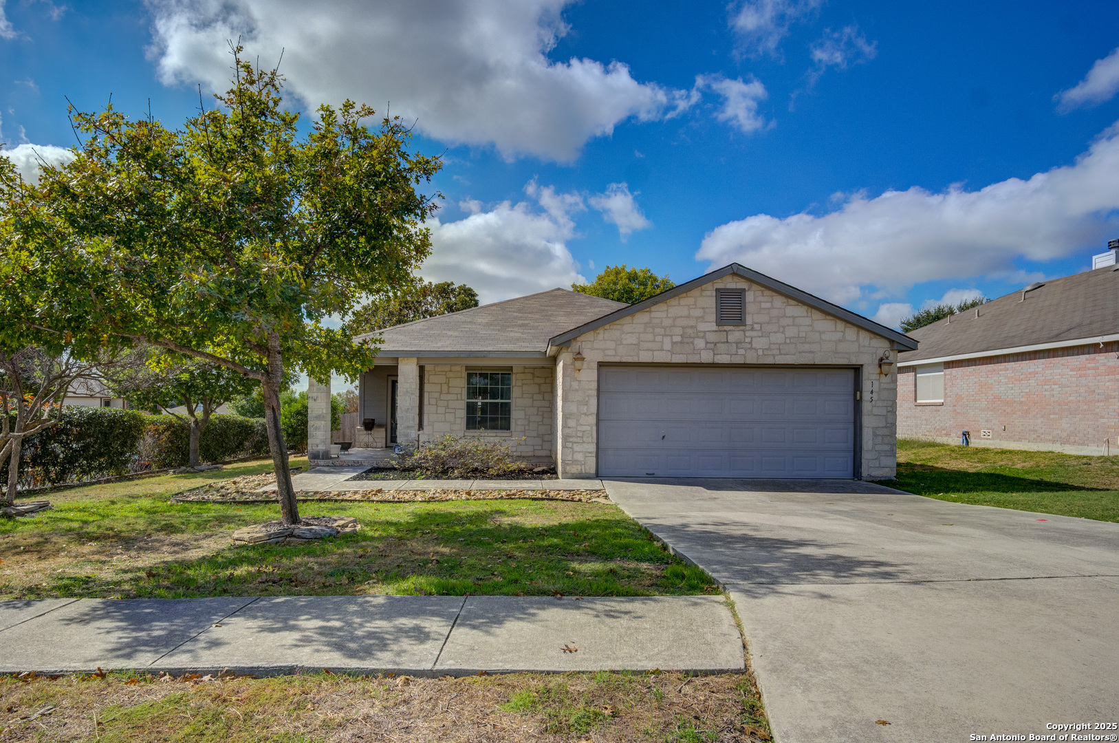 145 Stream Crossing Cibolo, TX 78108 - Photo 11 of 40 a front view of a house with a yard and garage