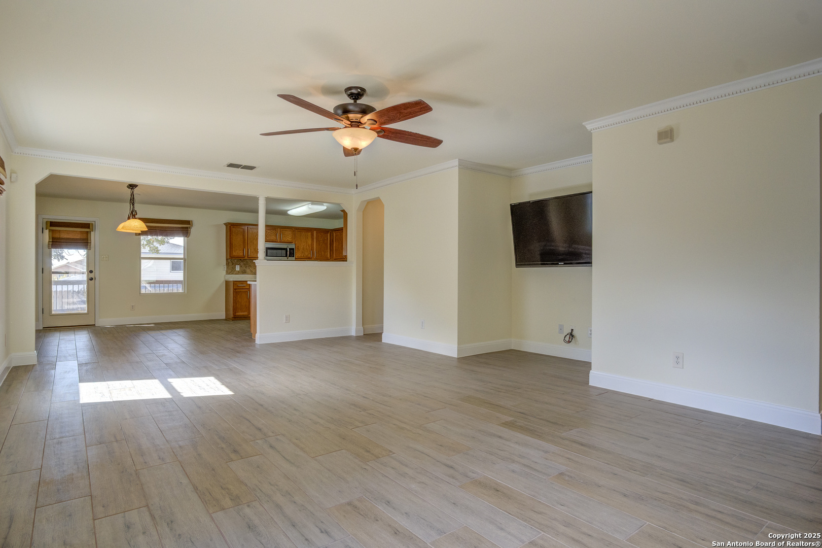 145 Stream Crossing Cibolo, TX 78108 - Photo 14 of 40 a view of empty room with wooden floor and fan