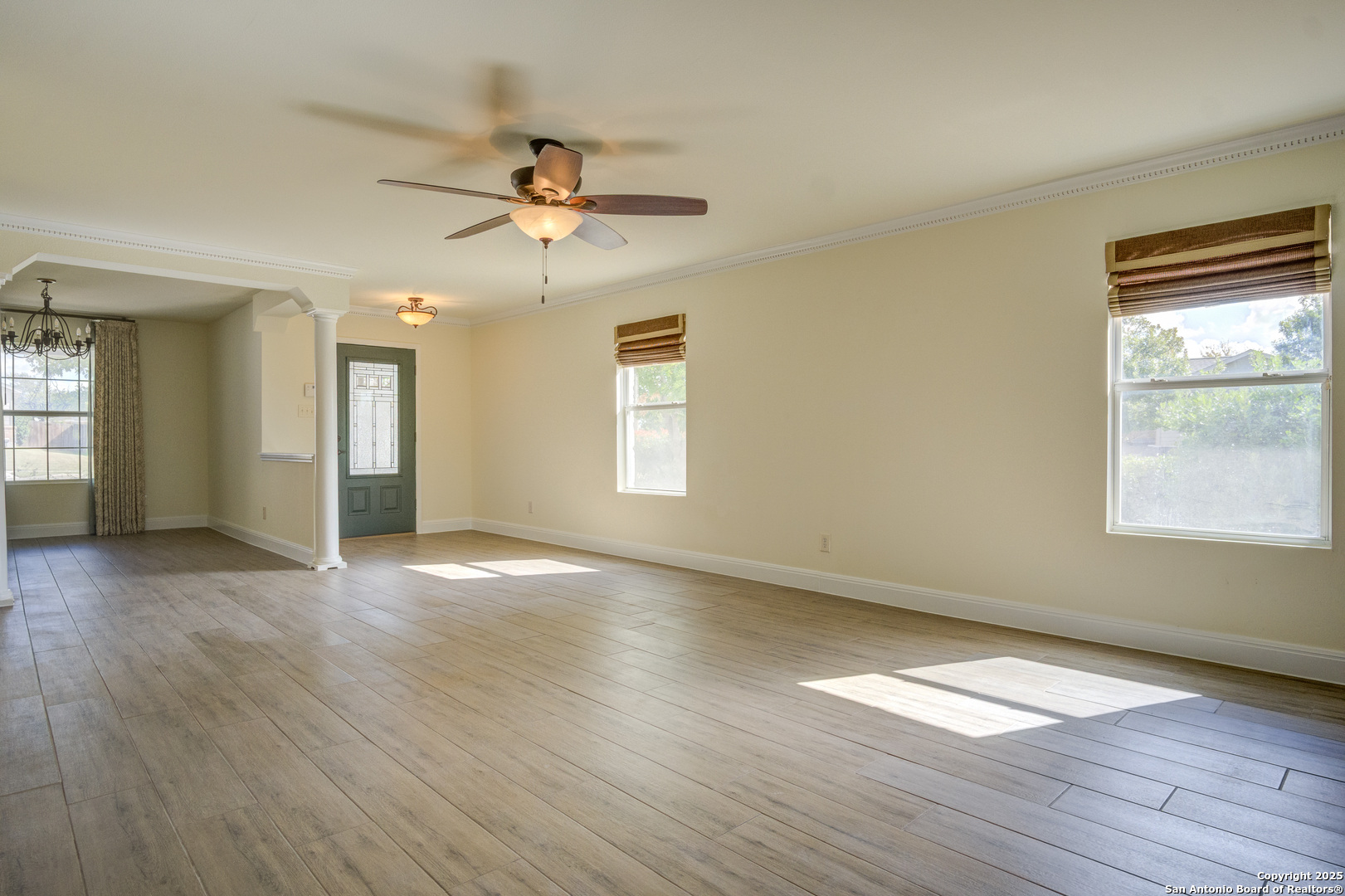 145 Stream Crossing Cibolo, TX 78108 - Photo 16 of 40 a view of an empty room with wooden floor and a window