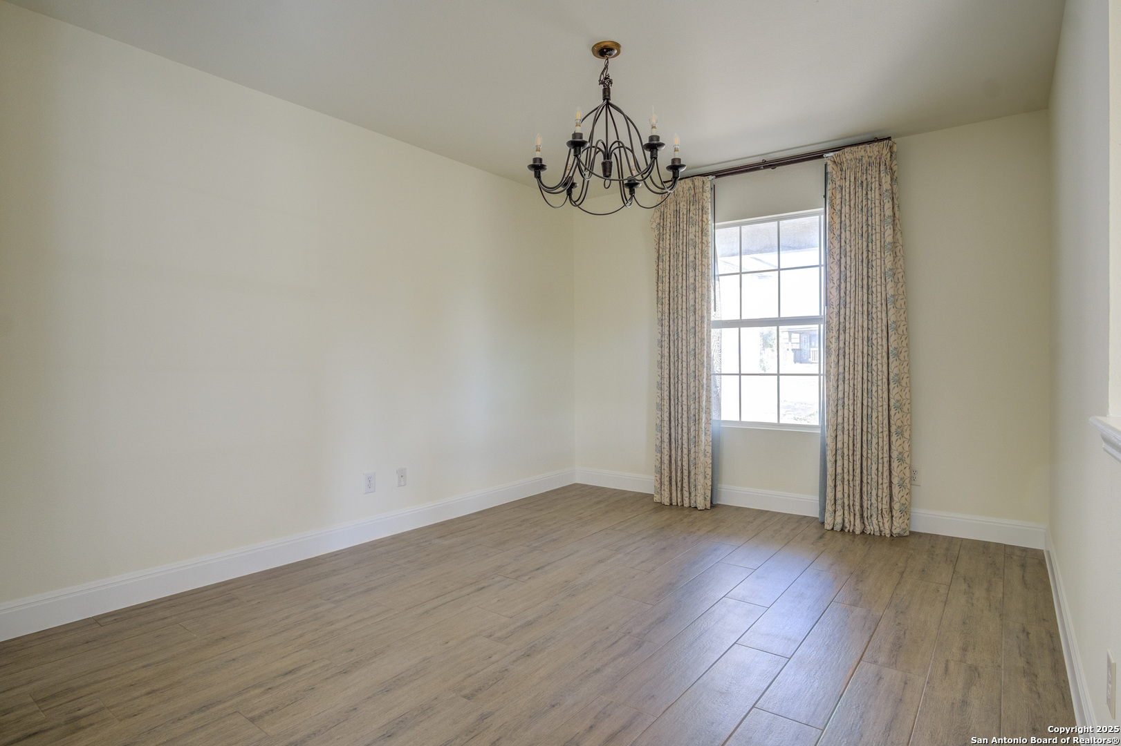 145 Stream Crossing Cibolo, TX 78108 - Photo 19 of 40 wooden floor in an empty room with a window