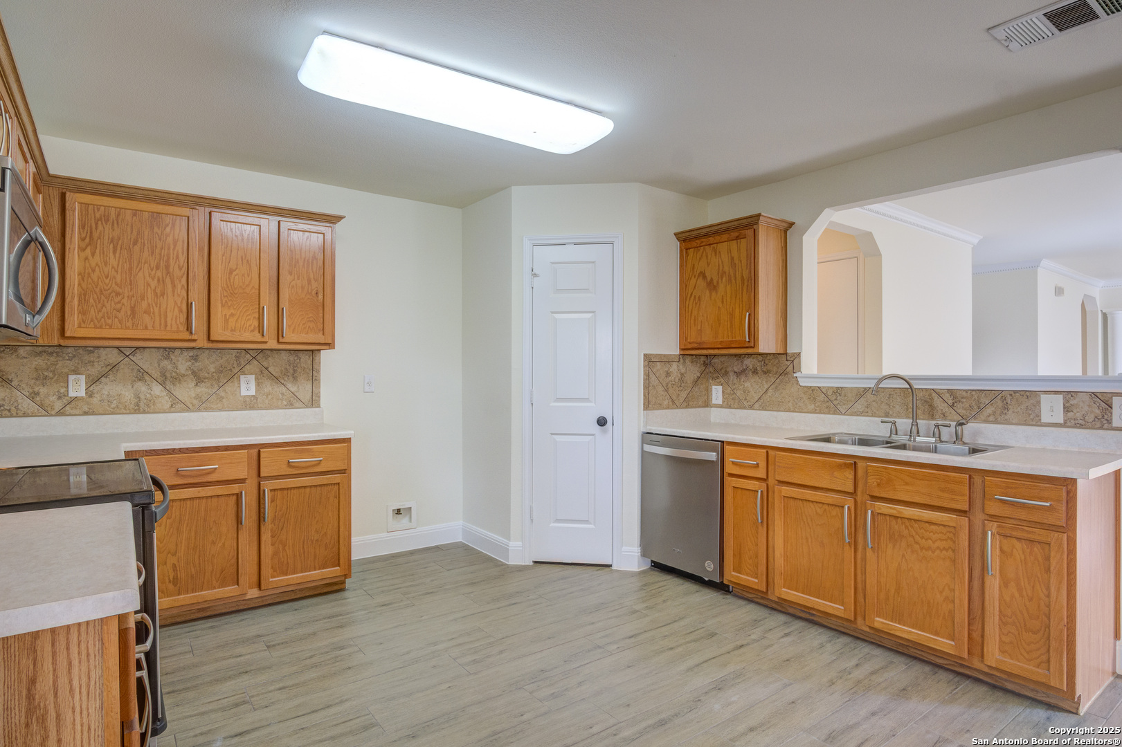 145 Stream Crossing Cibolo, TX 78108 - Photo 22 of 40 a spacious bathroom with a granite countertop sink and a mirror
