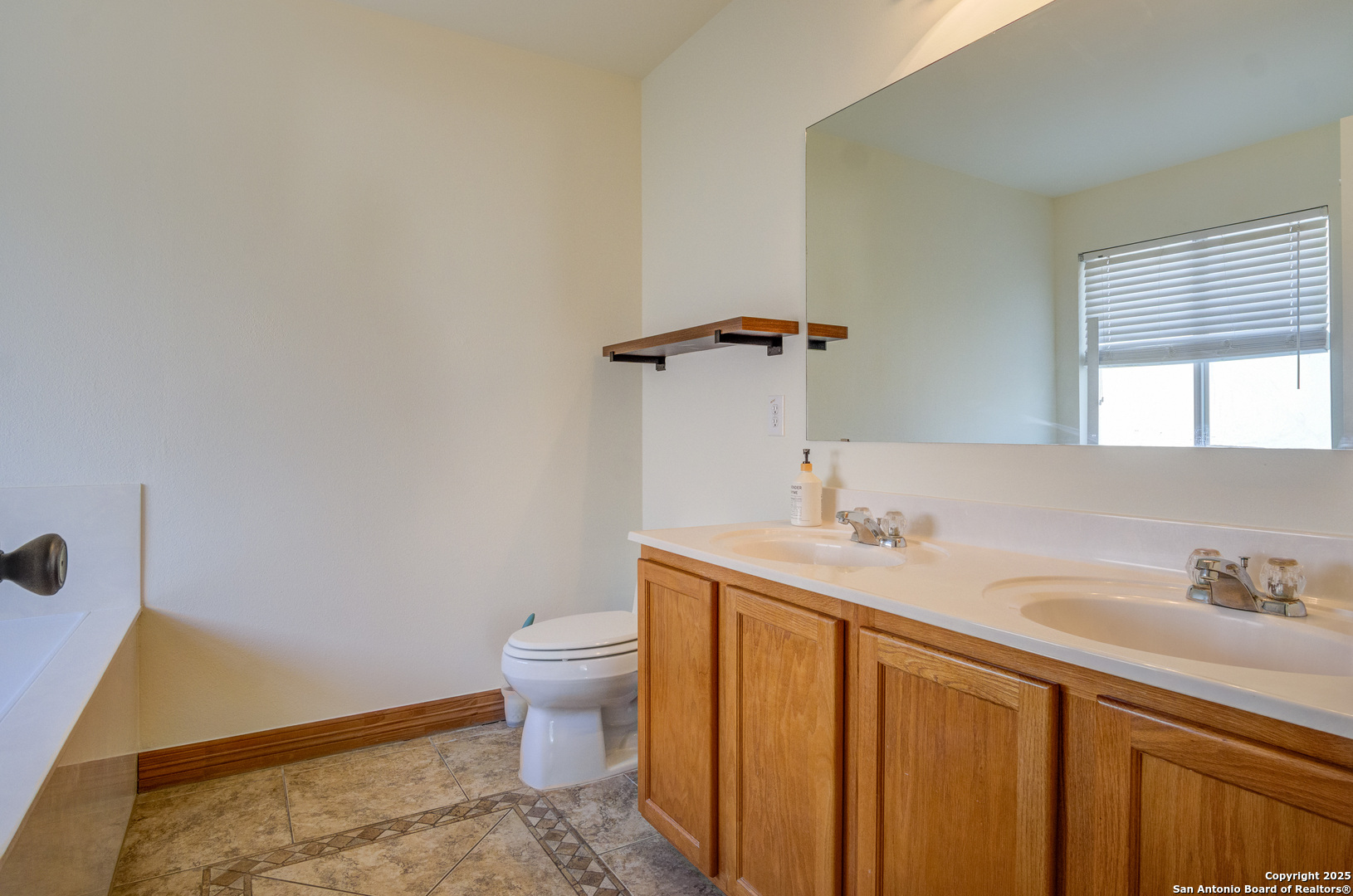 145 Stream Crossing Cibolo, TX 78108 - Photo 27 of 40 a bathroom with a sink and toilet