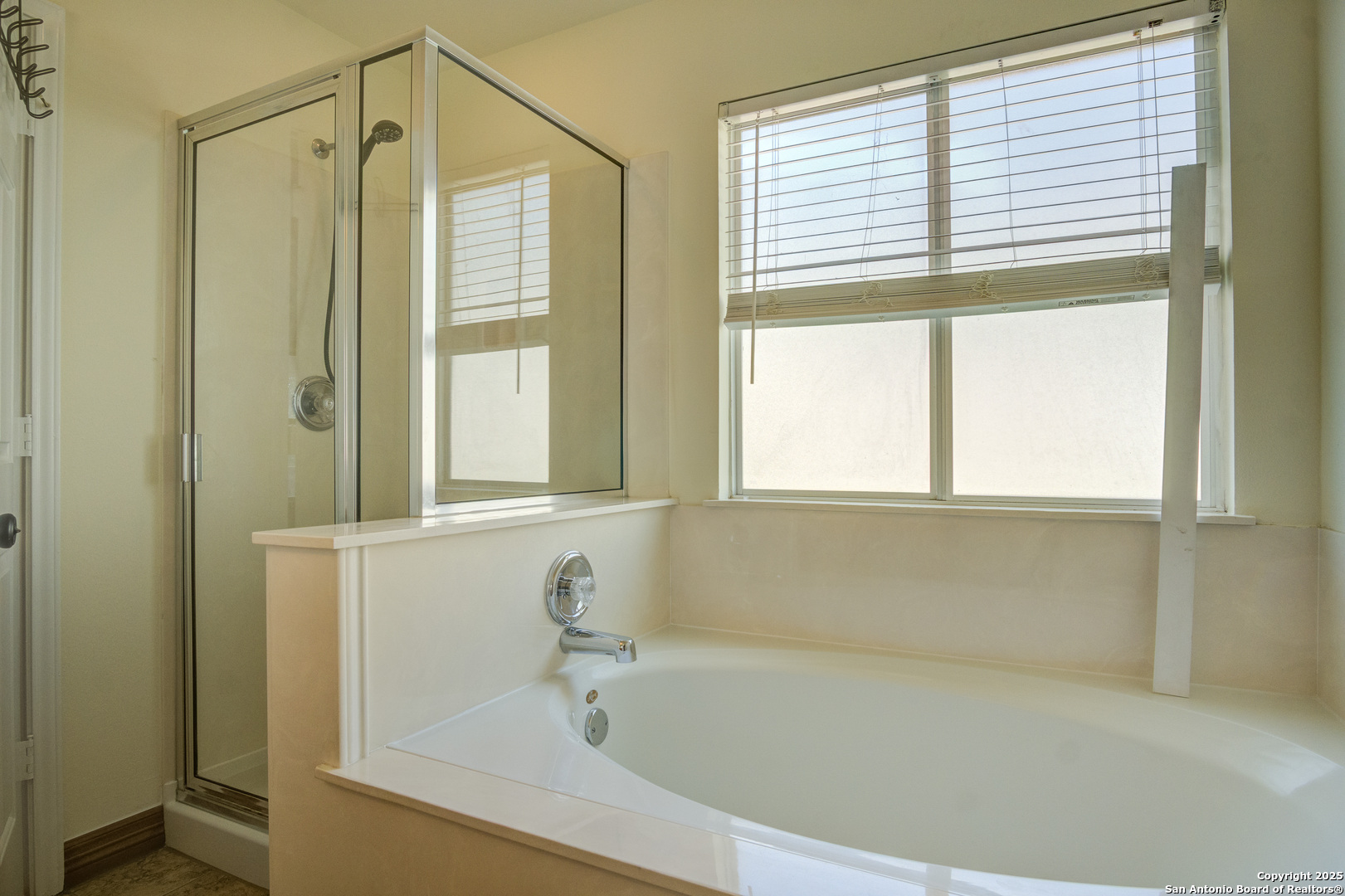 145 Stream Crossing Cibolo, TX 78108 - Photo 28 of 40 a white bath tub sitting next to a window