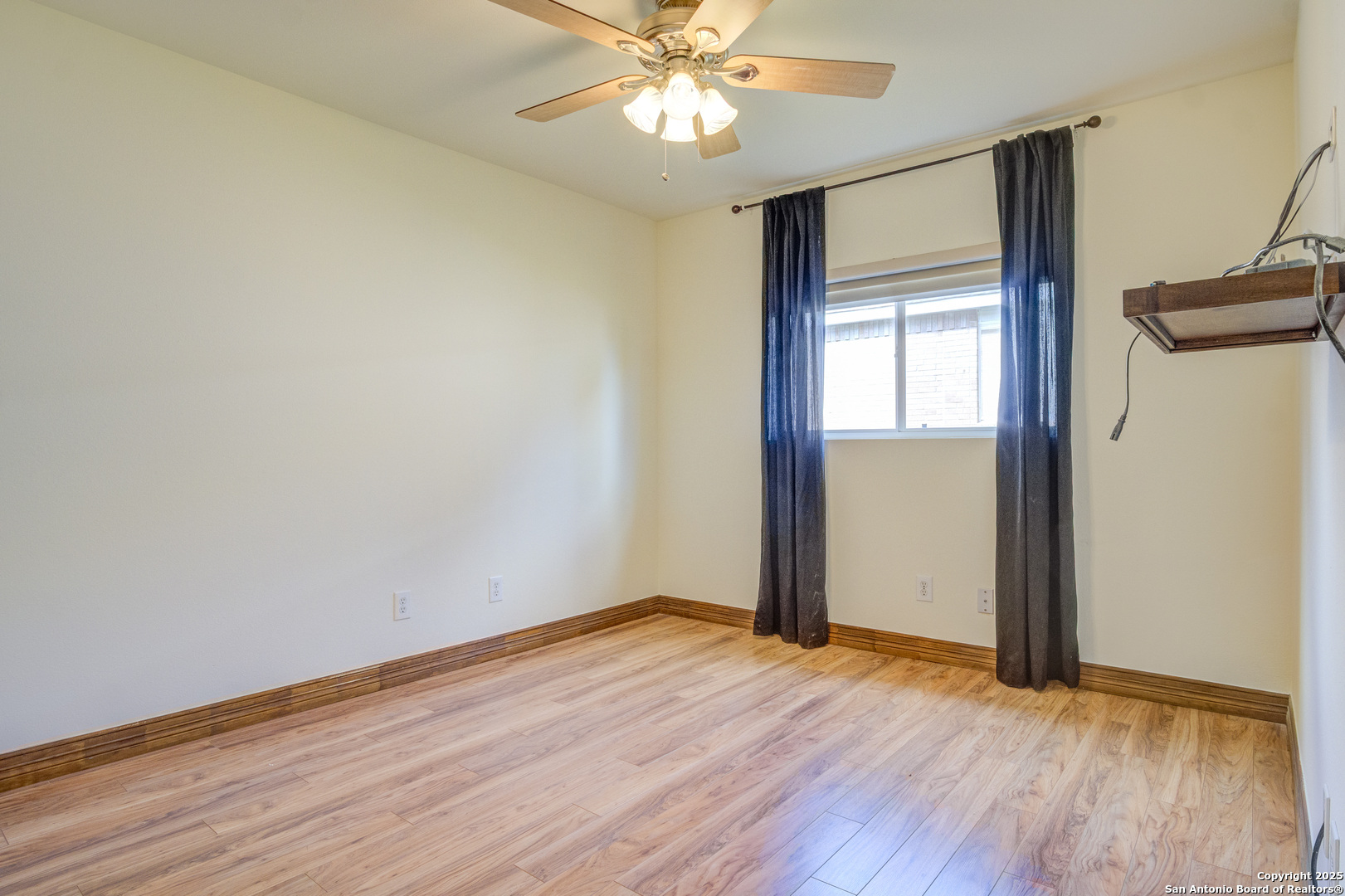 145 Stream Crossing Cibolo, TX 78108 - Photo 30 of 40 an empty room with wooden floor fan and windows