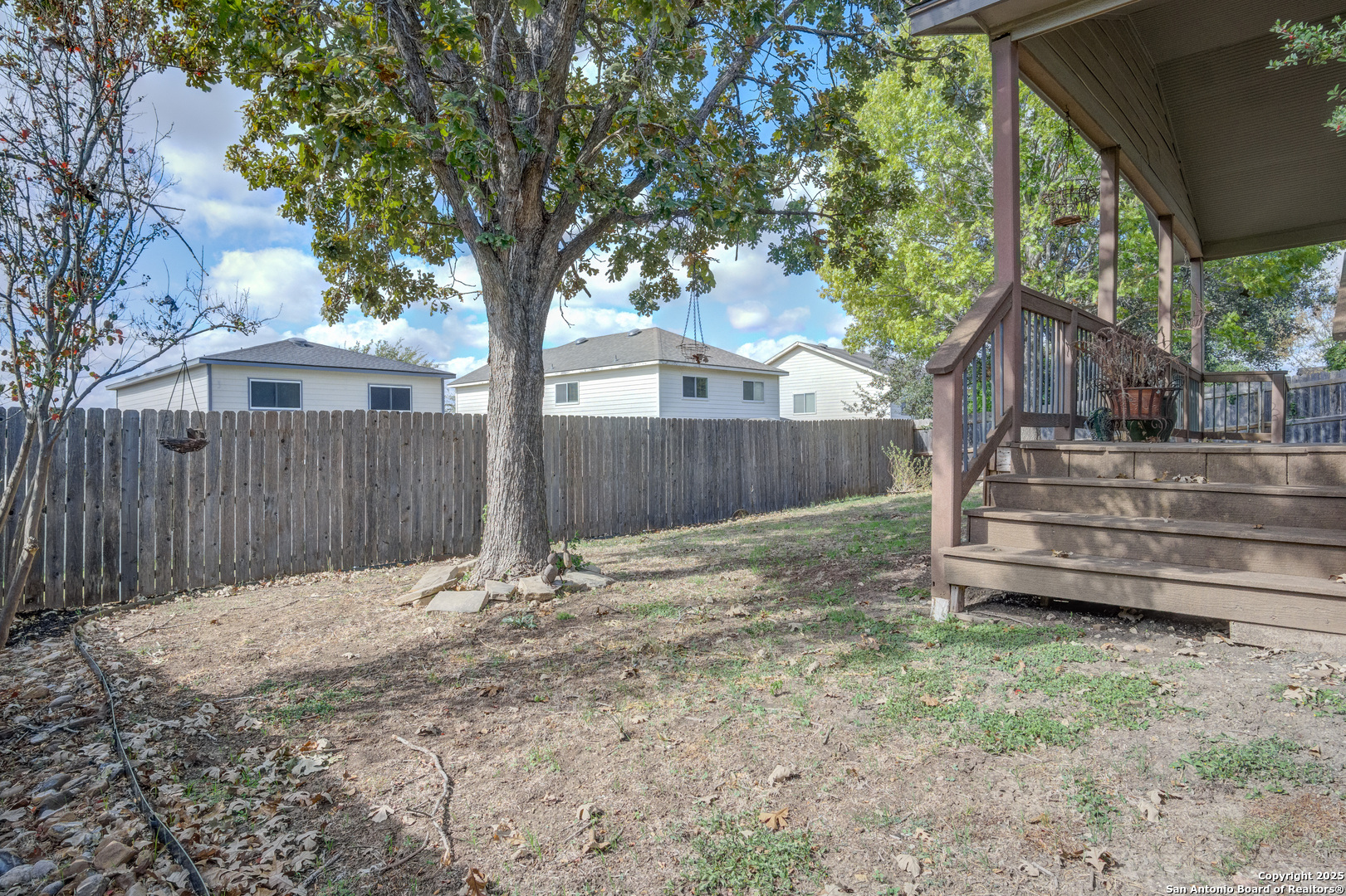 145 Stream Crossing Cibolo, TX 78108 - Photo 40 of 40 a backyard of a house with a tree and wooden fence
