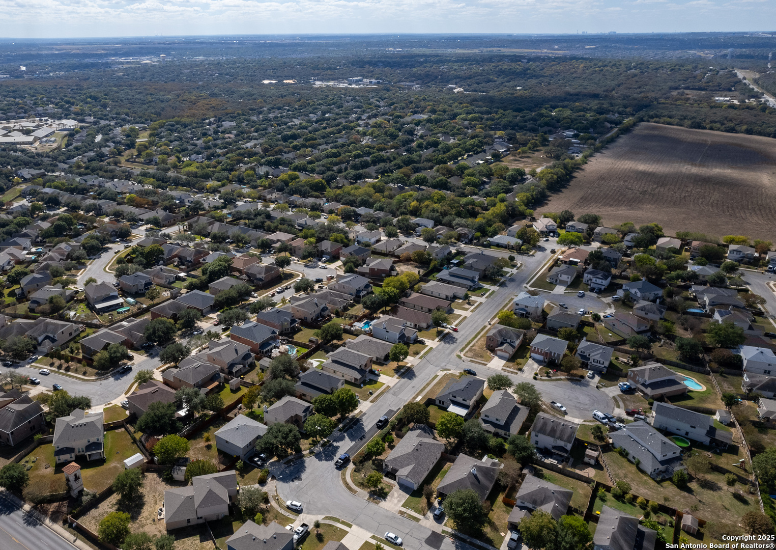 145 Stream Crossing Cibolo, TX 78108 - Photo 4 of 40 an aerial view of residential house and green space