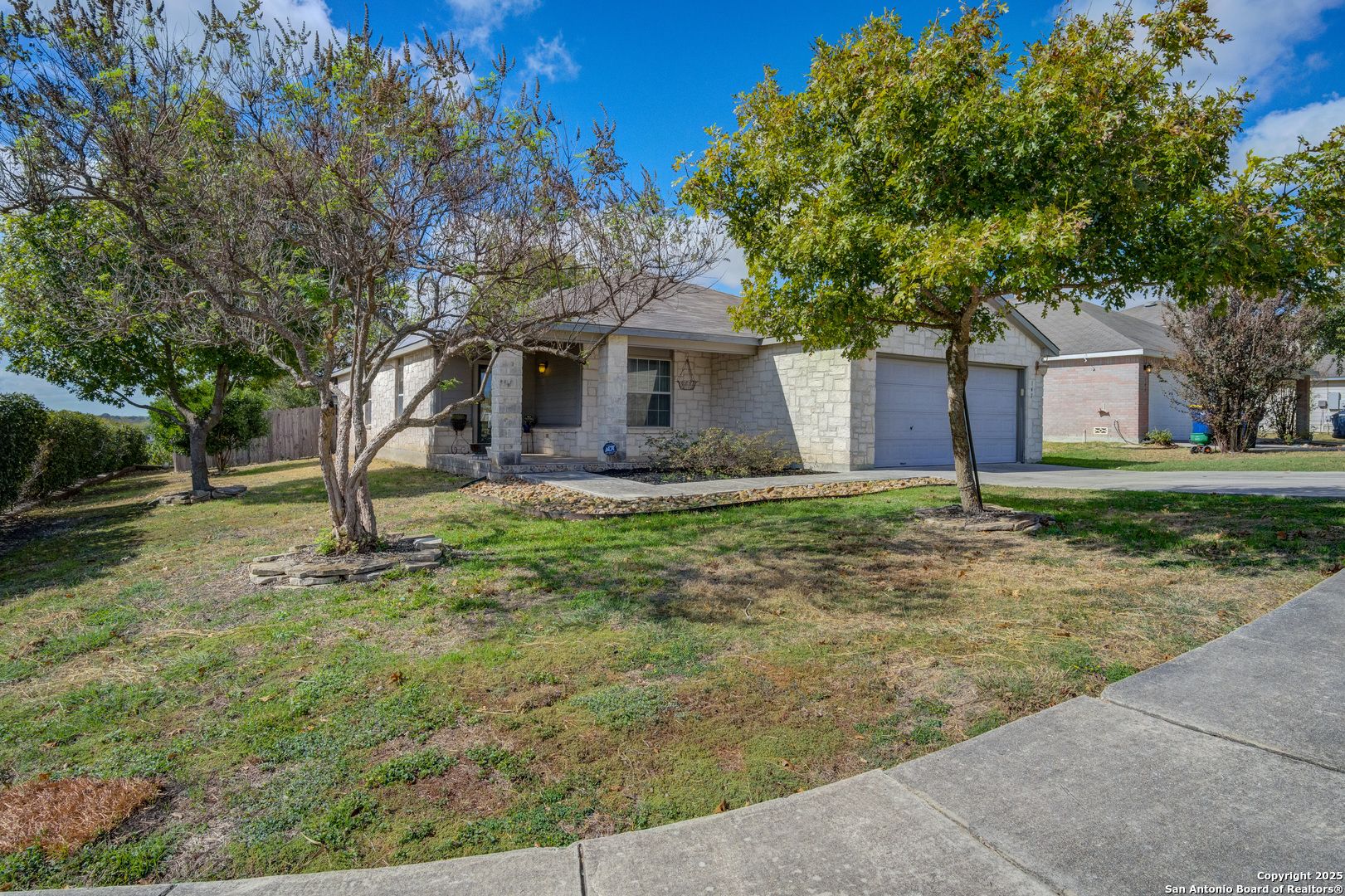 145 Stream Crossing Cibolo, TX 78108 - Photo 10 of 40 a front view of a house with garden
