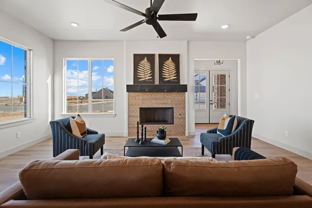 a living room with furniture and a fireplace