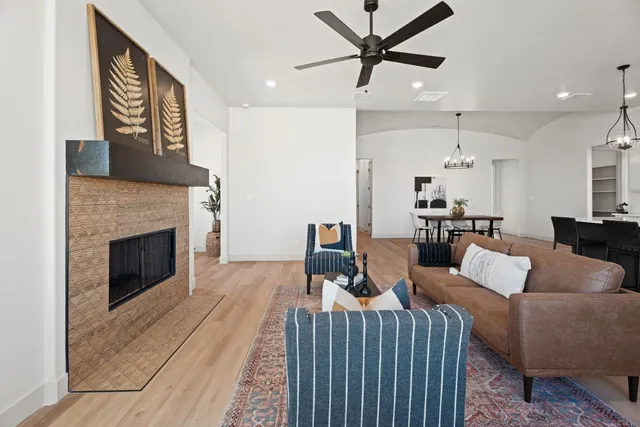 a living room with furniture and a fireplace