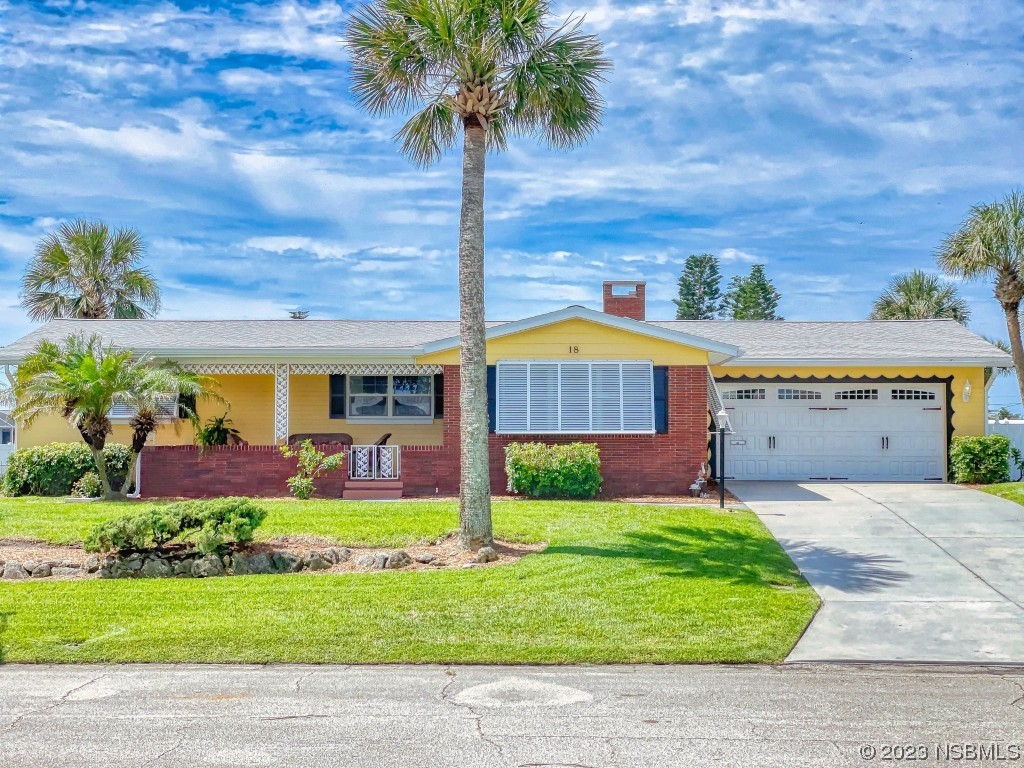 18 Silk Oaks Drive Ormond Beach, FL 32176 - Photo 1 of 46 a front view of house with yard and green space