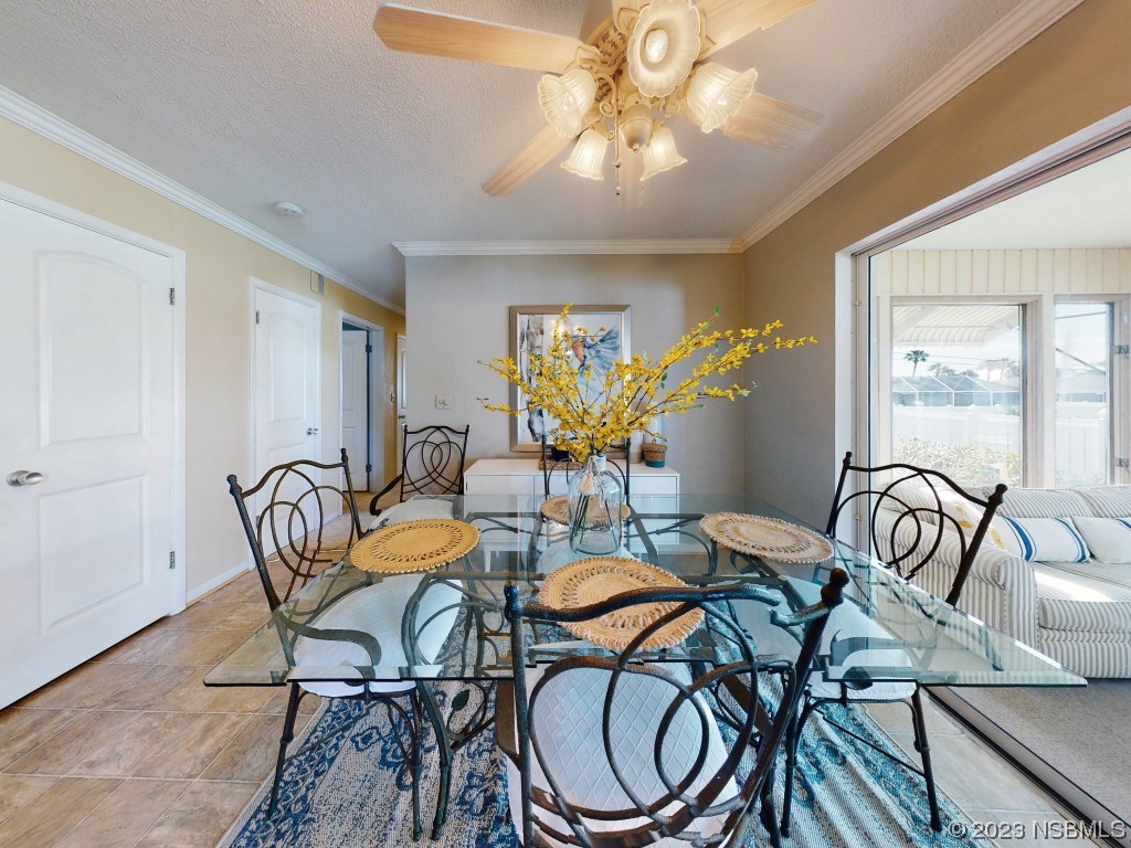18 Silk Oaks Drive Ormond Beach, FL 32176 - Photo 13 of 46 a view of a dining room with furniture window and wooden floor