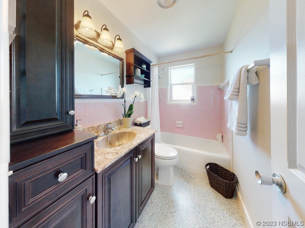 18 Silk Oaks Drive Ormond Beach, FL 32176 - Photo 20 of 46 a bathroom with a granite countertop sink toilet and shower