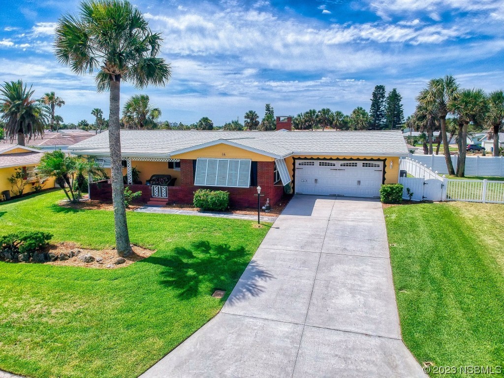 18 Silk Oaks Drive Ormond Beach, FL 32176 - Photo 2 of 46 a front view of house with yard and green space