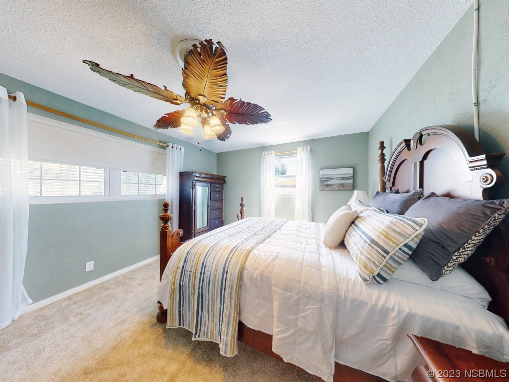 18 Silk Oaks Drive Ormond Beach, FL 32176 - Photo 30 of 46 a bedroom with a bed and window