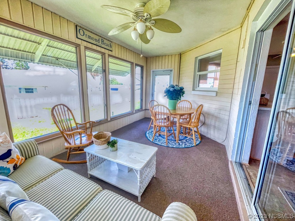 18 Silk Oaks Drive Ormond Beach, FL 32176 - Photo 33 of 46 a living room with furniture and a large window