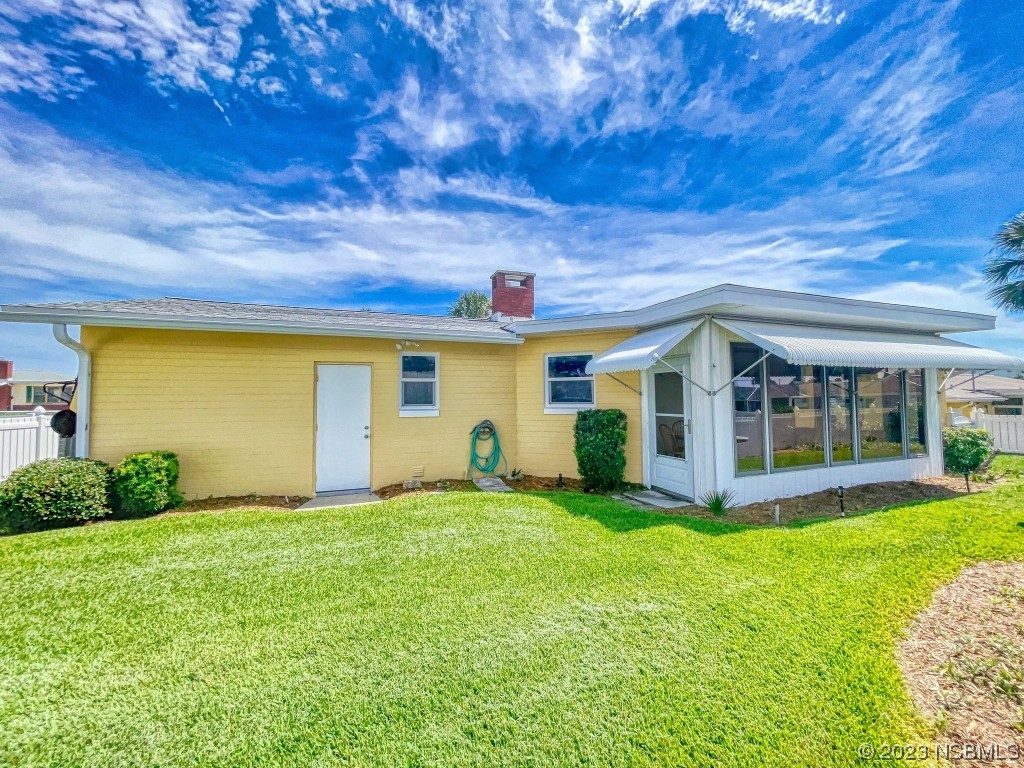 18 Silk Oaks Drive Ormond Beach, FL 32176 - Photo 36 of 46 a front view of a house with a yard