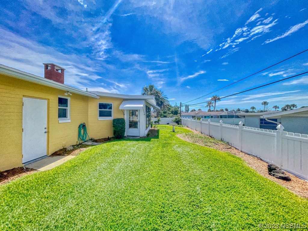 18 Silk Oaks Drive Ormond Beach, FL 32176 - Photo 37 of 46 a view of a backyard with swimming pool