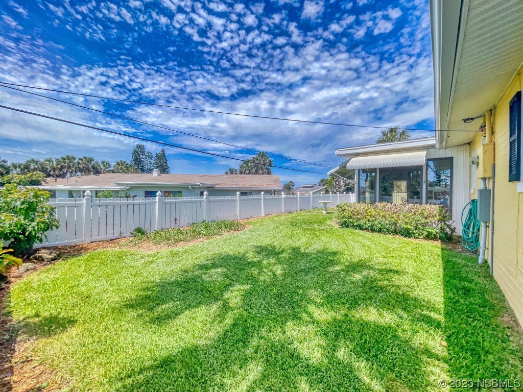18 Silk Oaks Drive Ormond Beach, FL 32176 - Photo 38 of 46 front view of a house with a yard