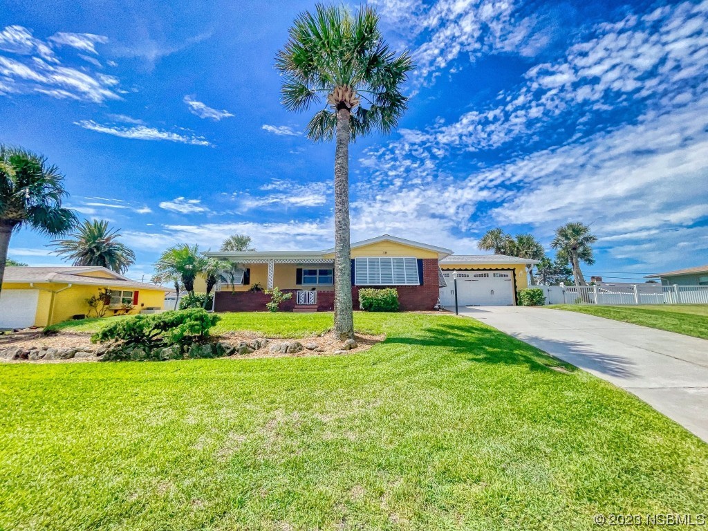 18 Silk Oaks Drive Ormond Beach, FL 32176 - Photo 40 of 46 a front view of a house with garden