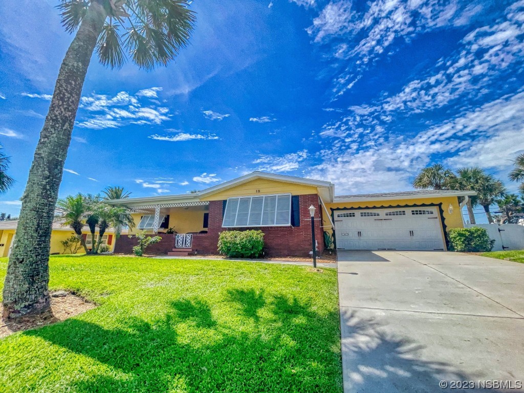 18 Silk Oaks Drive Ormond Beach, FL 32176 - Photo 41 of 46 a view of a house with a yard