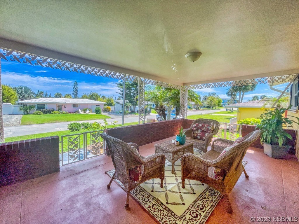 18 Silk Oaks Drive Ormond Beach, FL 32176 - Photo 5 of 46 a view of an outdoor dining space with furniture and garden