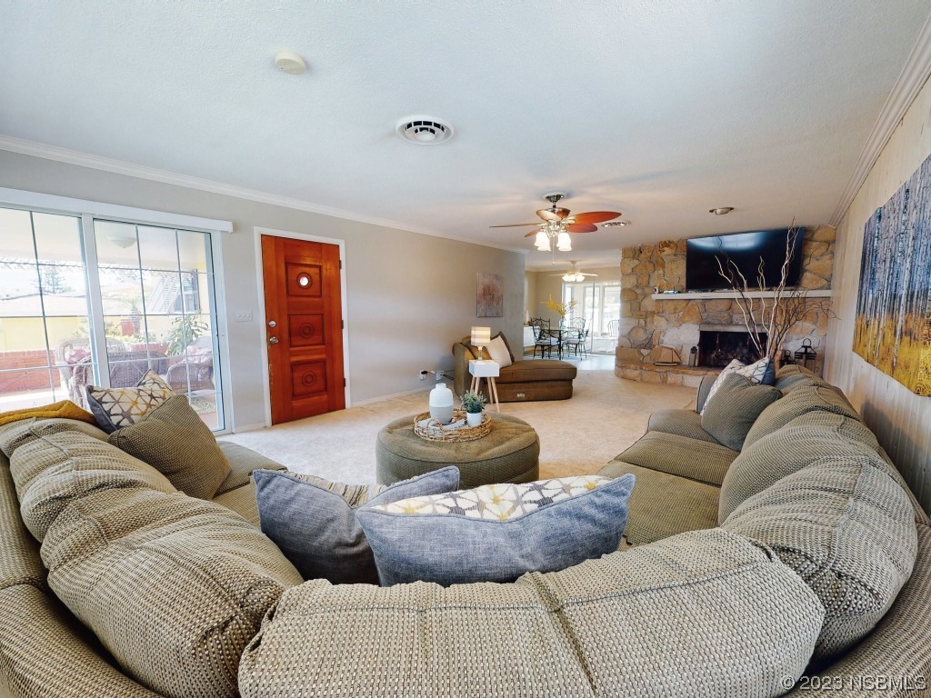18 Silk Oaks Drive Ormond Beach, FL 32176 - Photo 8 of 46 a living room with furniture and a large window