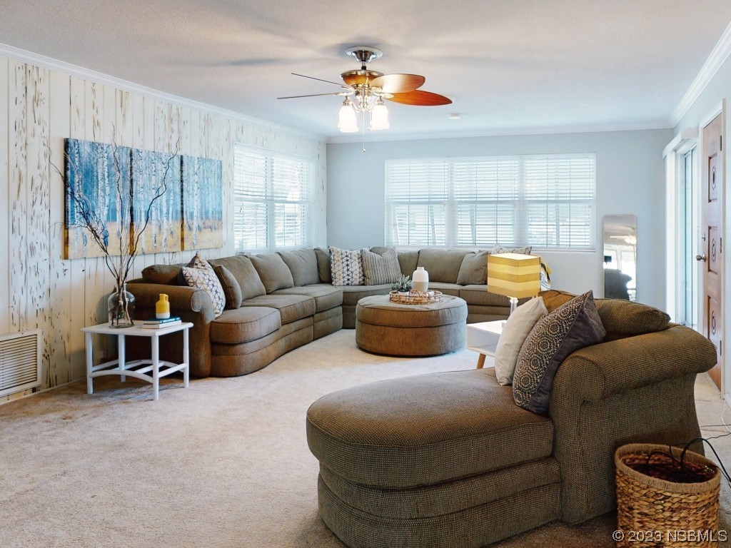 18 Silk Oaks Drive Ormond Beach, FL 32176 - Photo 10 of 46 a living room with furniture and a large window