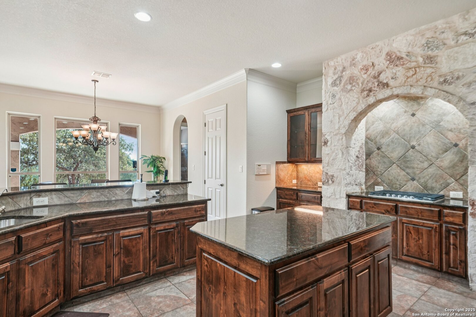 718 Ruidosa Downs Helotes, TX 78023 - Photo 7 of 50 a kitchen with a stove and a sink