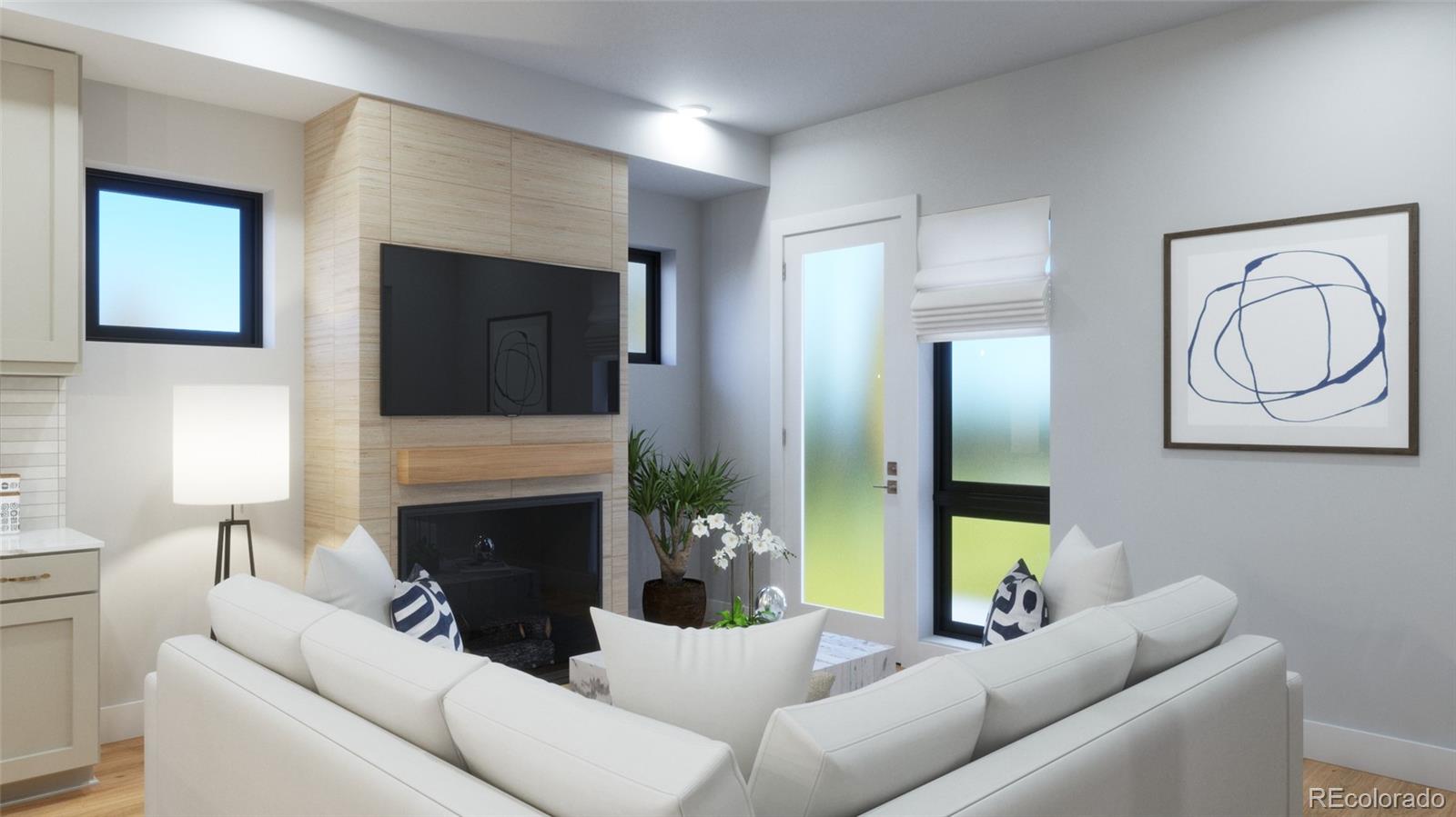 a living room with furniture a fireplace and a flat screen tv