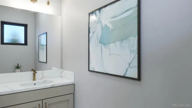 a bathroom with a sink and mirror
