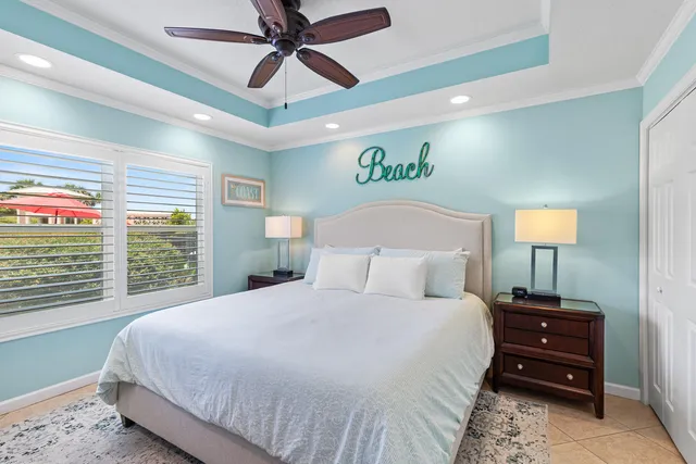 a bedroom with a bed and a lamp