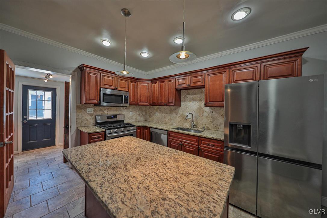641 7th Avenue Bethlehem, PA 18018 - Photo 11 of 29 a kitchen with stainless steel appliances granite countertop a refrigerator and a stove top oven