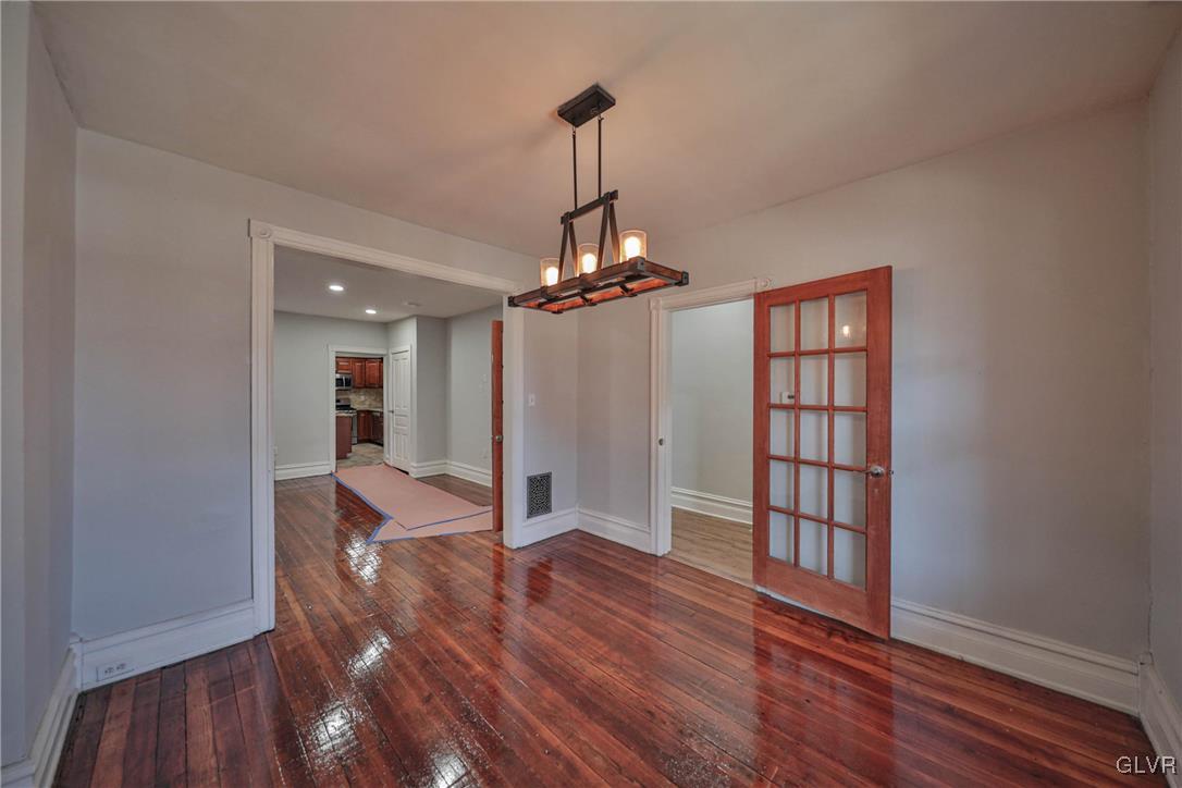 641 7th Avenue Bethlehem, PA 18018 - Photo 6 of 29 a view of a room with wooden floor staircase and a ceiling fan