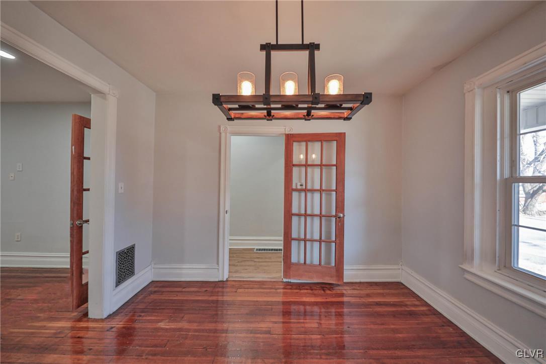 641 7th Avenue Bethlehem, PA 18018 - Photo 7 of 29 a view of empty room with wooden floor and fan