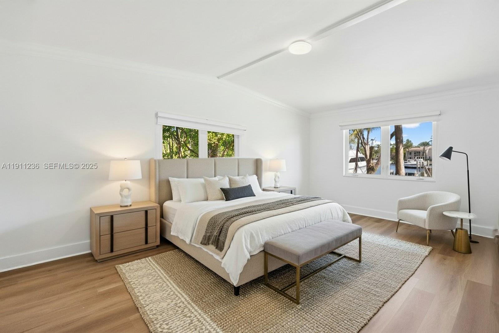 4 Harbor Point Key Biscayne, FL 33149 - Photo 15 of 30 a bedroom with a large bed and a couch