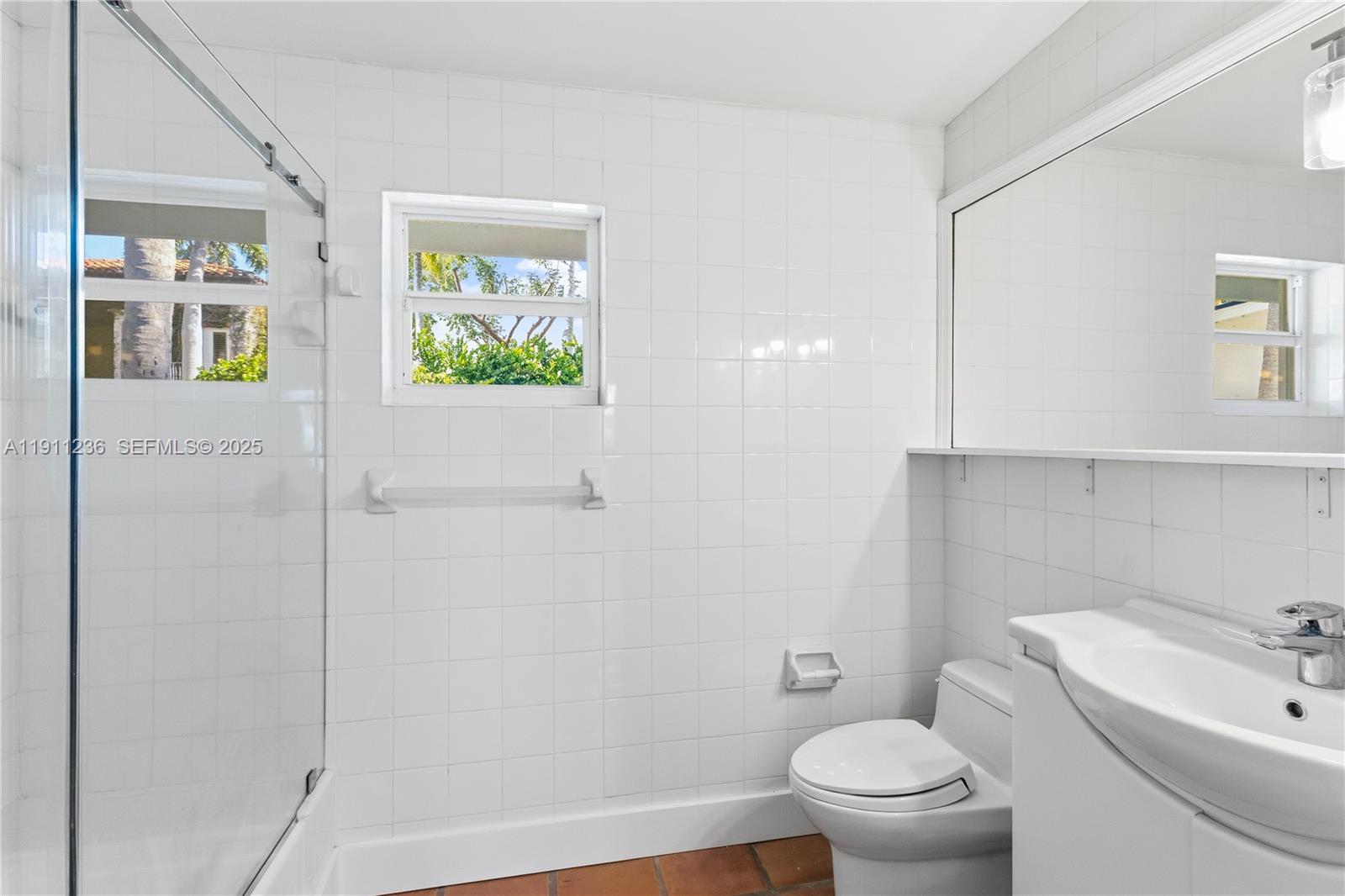 4 Harbor Point Key Biscayne, FL 33149 - Photo 16 of 30 a bathroom with a toilet a sink and tub