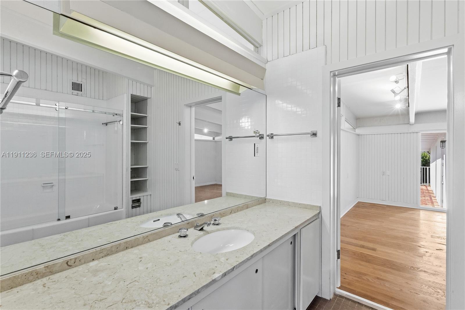 4 Harbor Point Key Biscayne, FL 33149 - Photo 19 of 30 a bathroom with a granite countertop sink mirror and double
