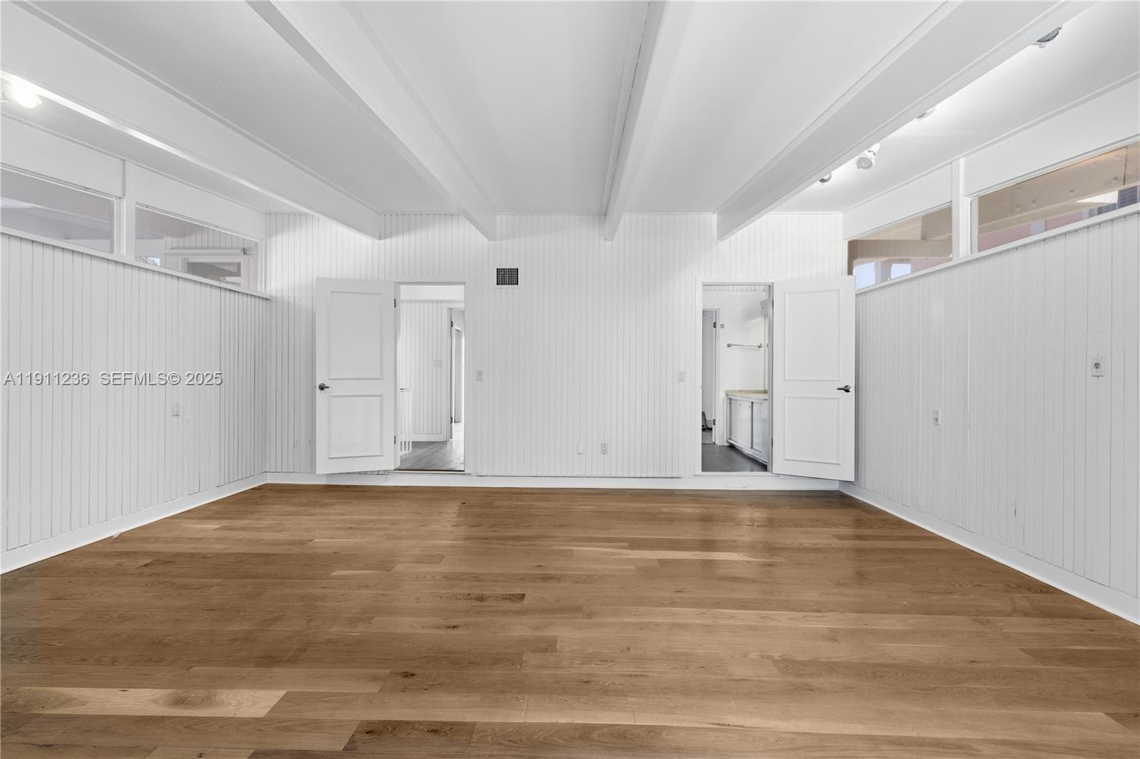 4 Harbor Point Key Biscayne, FL 33149 - Photo 21 of 30 a view of empty room with wooden floor